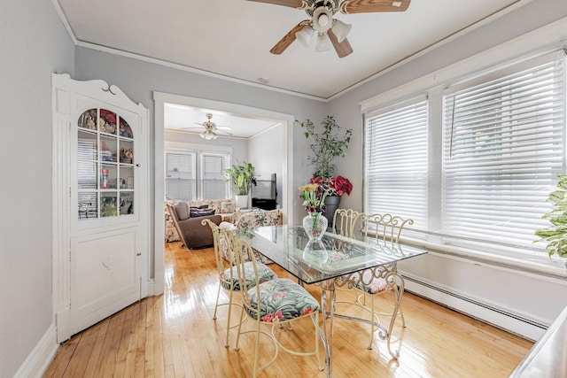 1418 S Cicero Ave, Cicero, IL 60804 - dining area with a baseboard heating unit, ceiling fan, plenty of natural light, and ornamental molding