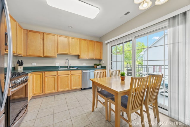 14 S Prospect St Unit 211, Roselle, IL 60172 - kitchen with appliances with stainless steel finishes, a sink, light brown cabinets, and dark countertops