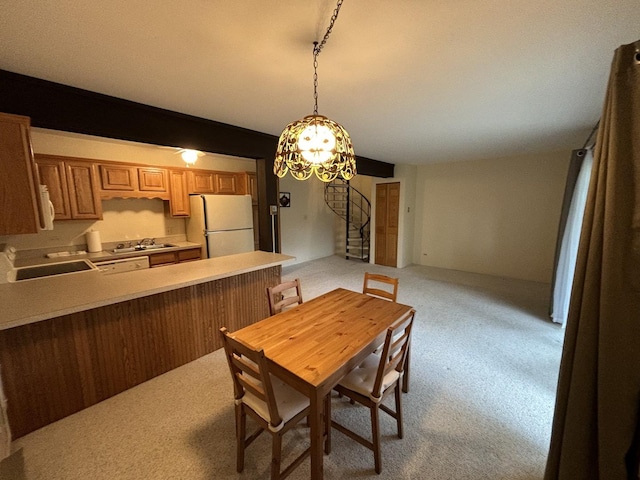 59 Vail Colony St Unit 3, Fox Lake, IL 60020 - dining room with light colored carpet and a chandelier