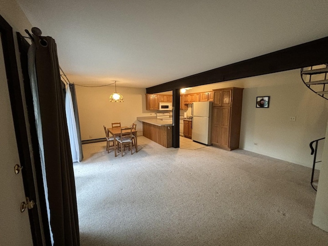 59 Vail Colony St Unit 3, Fox Lake, IL 60020 - kitchen with white appliances, light colored carpet, a peninsula, and a breakfast bar area