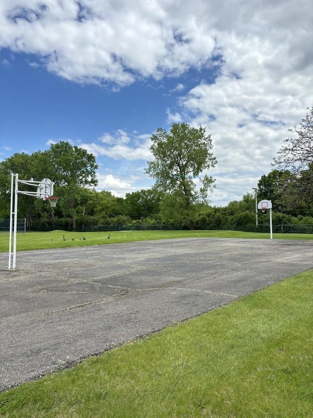 59 Vail Colony St Unit 3, Fox Lake, IL 60020 - view of basketball court with community basketball court and a lawn