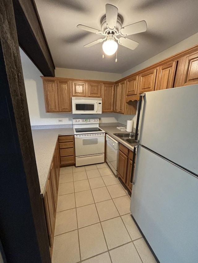 59 Vail Colony St Unit 3, Fox Lake, IL 60020 - kitchen with white appliances, light tile patterned floors, brown cabinets, a ceiling fan, and light countertops
