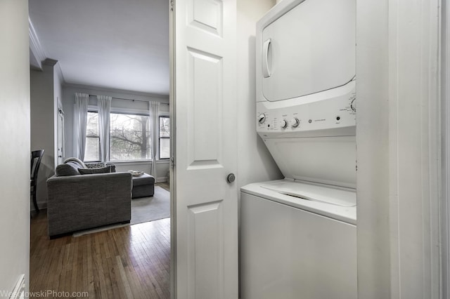 4005 N Southport Ave Unit 2, Chicago, IL 60613 - laundry area with stacked washer / dryer, hardwood / wood-style flooring, and crown molding