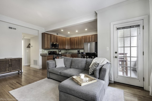 4005 N Southport Ave Unit 2, Chicago, IL 60613 - living area featuring ornamental molding, dark wood-type flooring, baseboards, and recessed lighting