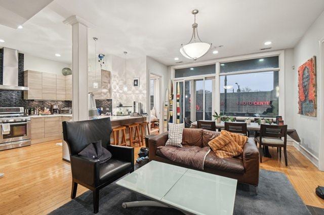 2424 W Chicago Ave Unit 202, Chicago, IL 60622 - living area featuring recessed lighting, light wood-type flooring, and ornate columns
