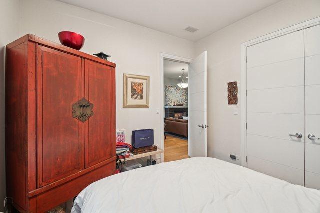 2424 W Chicago Ave Unit 202, Chicago, IL 60622 - bedroom with wood finished floors and a closet