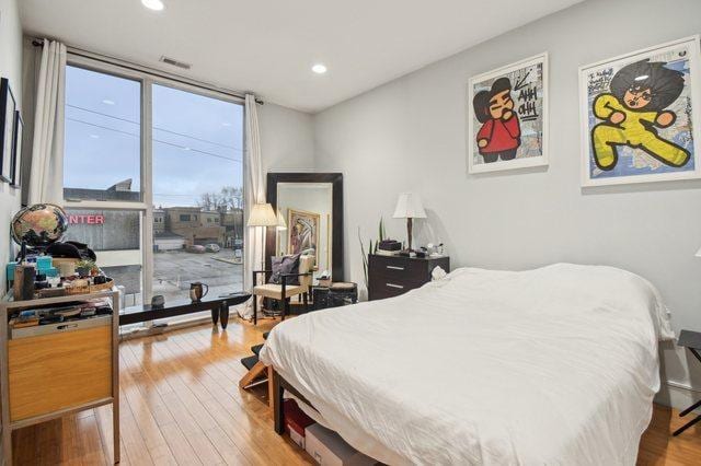 2424 W Chicago Ave Unit 202, Chicago, IL 60622 - bedroom featuring hardwood / wood-style flooring, recessed lighting, and floor to ceiling windows