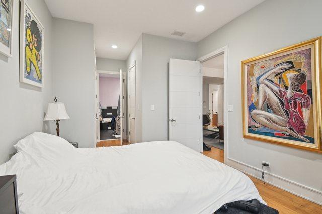 2424 W Chicago Ave Unit 202, Chicago, IL 60622 - bedroom with wood finished floors, recessed lighting, and baseboards
