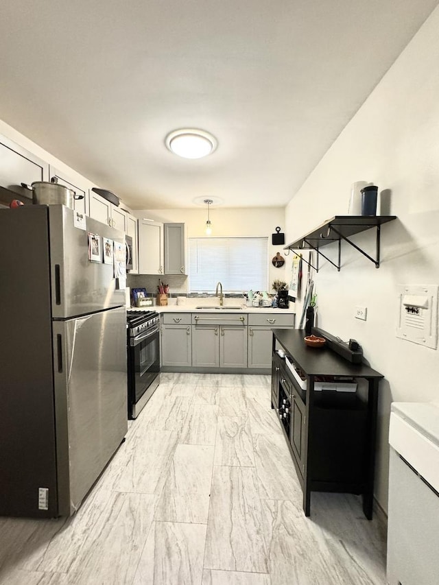 6141 N Seeley Ave Unit 1D, Chicago, IL 60659 - kitchen featuring appliances with stainless steel finishes, gray cabinetry, a sink, and light countertops