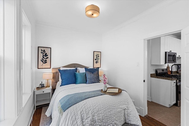 2158 W Giddings St Unit 1, Chicago, IL 60625 - bedroom with ornamental molding and dark wood-style floors