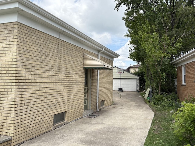 11138 Shaw St, Westchester, IL 60154 - view of side of home featuring brick siding, a garage, and an outdoor structure