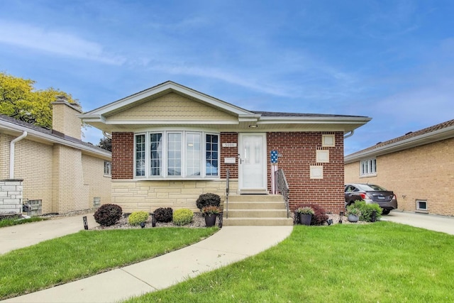 5004 N Knight Ave, Norridge, IL 60706 - view of front of house featuring a front lawn, entry steps, stone siding, and brick siding