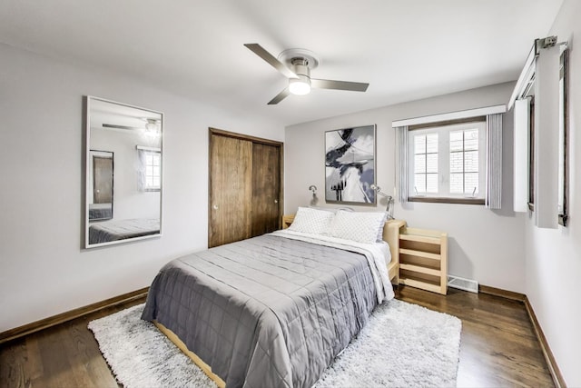 5004 N Knight Ave, Norridge, IL 60706 - bedroom with baseboards, multiple windows, and wood finished floors