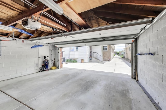 5004 N Knight Ave, Norridge, IL 60706 - garage with a garage door opener and concrete block wall