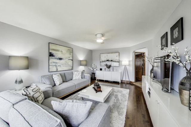 5004 N Knight Ave, Norridge, IL 60706 - living room featuring ceiling fan, dark wood finished floors, and arched walkways