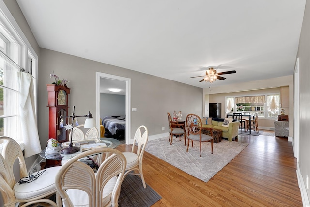 8819 Acorn Path, Wonder Lake, IL 60097 - dining space with a ceiling fan, light wood-style floors, and baseboards