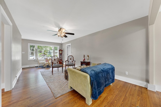 8819 Acorn Path, Wonder Lake, IL 60097 - living room featuring a ceiling fan, wood finished floors, and baseboards