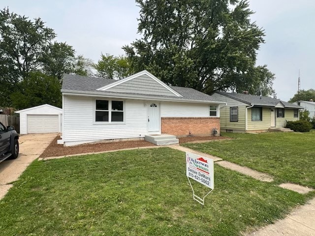 1112 Drexel Blvd, Machesney Park, IL 61115 - ranch-style home with an outdoor structure, driveway, a front yard, a detached garage, and brick siding