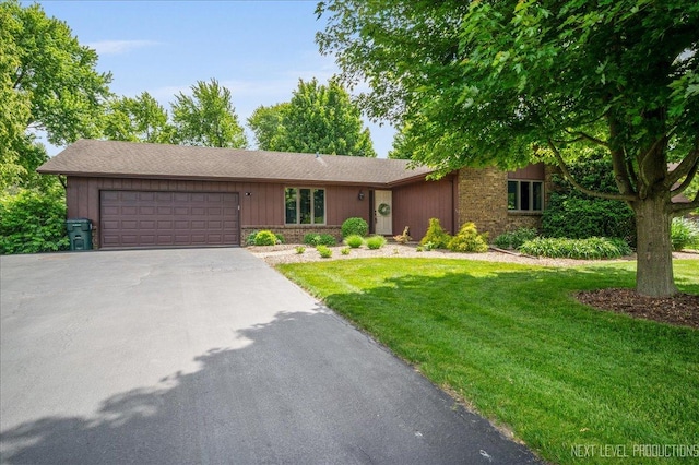 38W277 Monterey Dr, Batavia, IL 60510 - single story home featuring asphalt driveway, a garage, a front lawn, and stone siding
