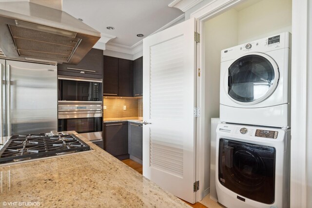 2550 N Lakeview Ave Unit N903, Chicago, IL 60614 - washroom with stacked washer / dryer and light wood-style floors