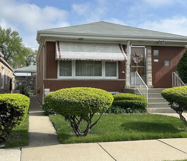 7140 W 64th St, Chicago, IL 60638 - bungalow-style home with brick siding