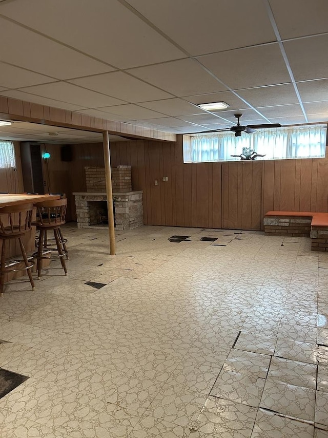 7140 W 64th St, Chicago, IL 60638 - below grade area featuring wood walls, a paneled ceiling, a dry bar, and healthy amount of natural light