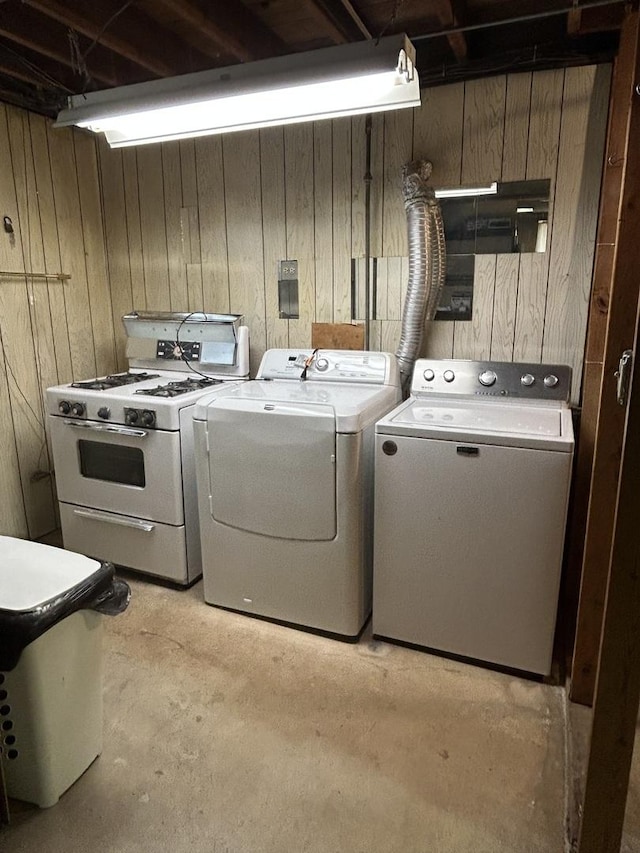 7140 W 64th St, Chicago, IL 60638 - washroom featuring separate washer and dryer and wooden walls