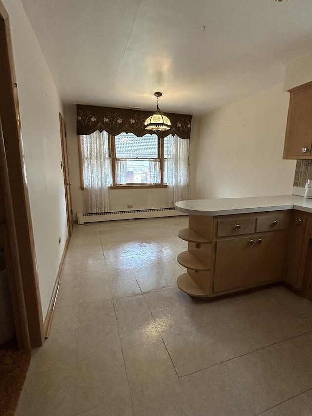 7140 W 64th St, Chicago, IL 60638 - kitchen featuring a baseboard radiator, a peninsula, light tile patterned floors, and light countertops