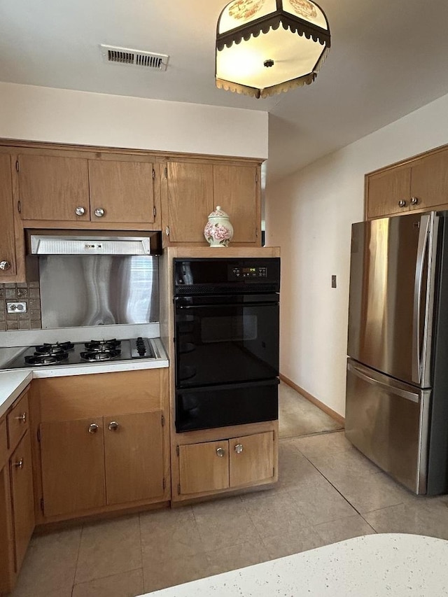 7140 W 64th St, Chicago, IL 60638 - kitchen featuring freestanding refrigerator, a warming drawer, black oven, gas stovetop, and under cabinet range hood