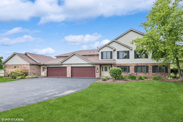 19463 Manchester Dr Unit 2, Mokena, IL 60448 - view of front facade featuring an attached garage, asphalt driveway, a front yard, and brick siding