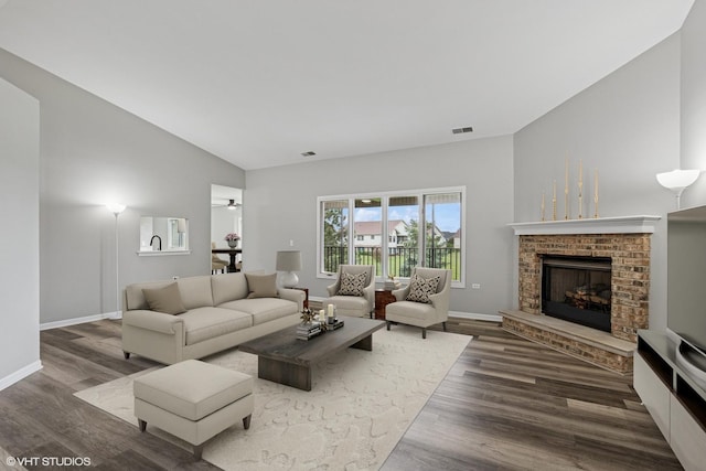 19463 Manchester Dr Unit 2, Mokena, IL 60448 - living area featuring a brick fireplace, wood finished floors, baseboards, and high vaulted ceiling