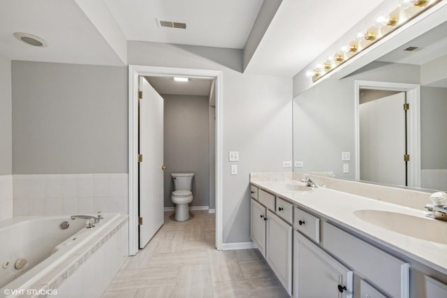19463 Manchester Dr Unit 2, Mokena, IL 60448 - full bath featuring double vanity, a tub with jets, toilet, and baseboards