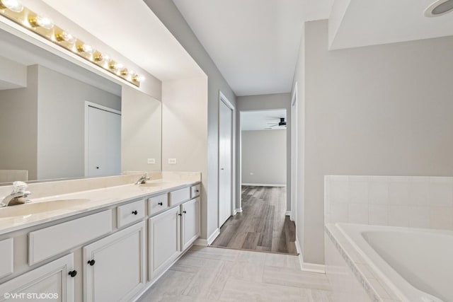 19463 Manchester Dr Unit 2, Mokena, IL 60448 - bathroom featuring double vanity, a garden tub, and baseboards