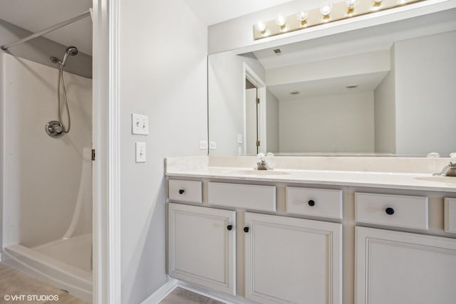 19463 Manchester Dr Unit 2, Mokena, IL 60448 - full bath with double vanity, a stall shower, and baseboards