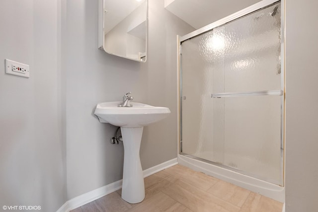 19463 Manchester Dr Unit 2, Mokena, IL 60448 - full bathroom featuring a shower stall, baseboards, and a sink