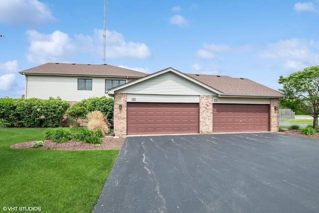 19463 Manchester Dr Unit 2, Mokena, IL 60448 - view of front facade featuring asphalt driveway, an attached garage, brick siding, and a front yard