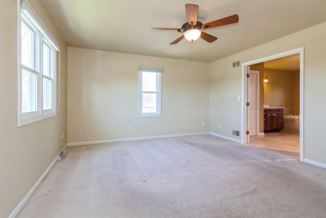 230 S Constitution Dr, Aurora, IL 60506 - unfurnished room featuring ceiling fan, light colored carpet, and baseboards
