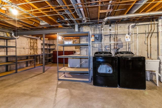 230 S Constitution Dr, Aurora, IL 60506 - unfinished basement featuring separate washer and dryer, electric panel, and a sink