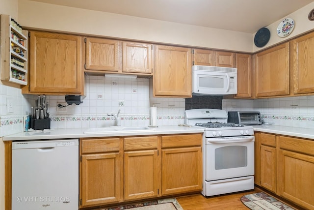 2133 Coldspring Rd, Arlington Heights, IL 60004 - kitchen featuring white appliances, light countertops, decorative backsplash, and light wood-style floors