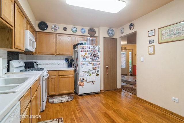 2133 Coldspring Rd, Arlington Heights, IL 60004 - kitchen with white appliances, light wood-type flooring, light countertops, and decorative backsplash