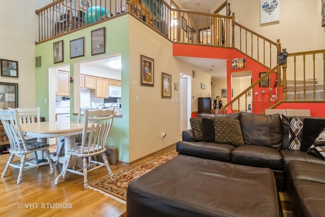 2133 Coldspring Rd, Arlington Heights, IL 60004 - living area featuring a high ceiling, light wood finished floors, and stairway