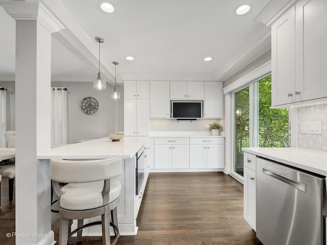 1465 Cantigny Way, Wheaton, IL 60189 - kitchen featuring stainless steel dishwasher, ornamental molding, light countertops, white cabinets, and a kitchen breakfast bar