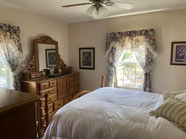 2655 W 97th Pl, Evergreen Park, IL 60805 - bedroom with a ceiling fan and a textured ceiling