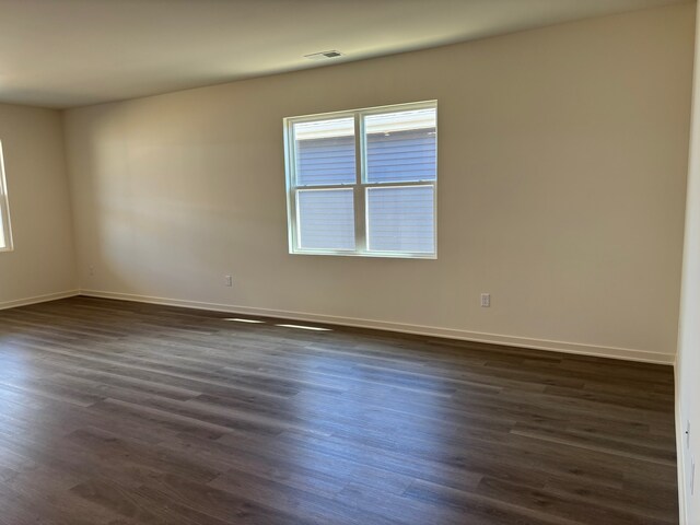 2278 Elderberry Ct, Wonder Lake, IL 60097 - empty room featuring dark wood-style flooring and baseboards
