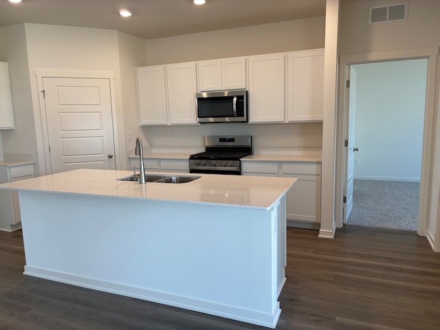 2278 Elderberry Ct, Wonder Lake, IL 60097 - kitchen with appliances with stainless steel finishes, a sink, recessed lighting, white cabinets, and dark wood-style floors