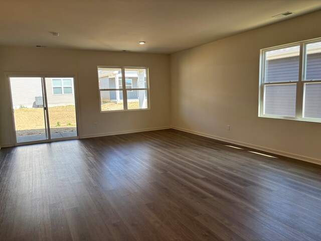 2278 Elderberry Ct, Wonder Lake, IL 60097 - spare room featuring baseboards and dark wood-type flooring