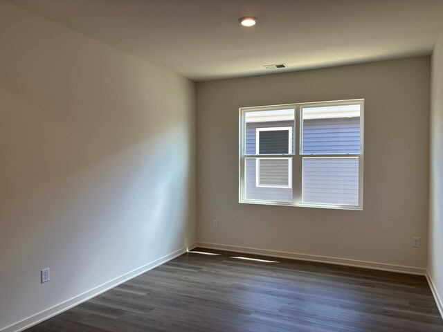 2278 Elderberry Ct, Wonder Lake, IL 60097 - empty room with dark wood-style floors and baseboards