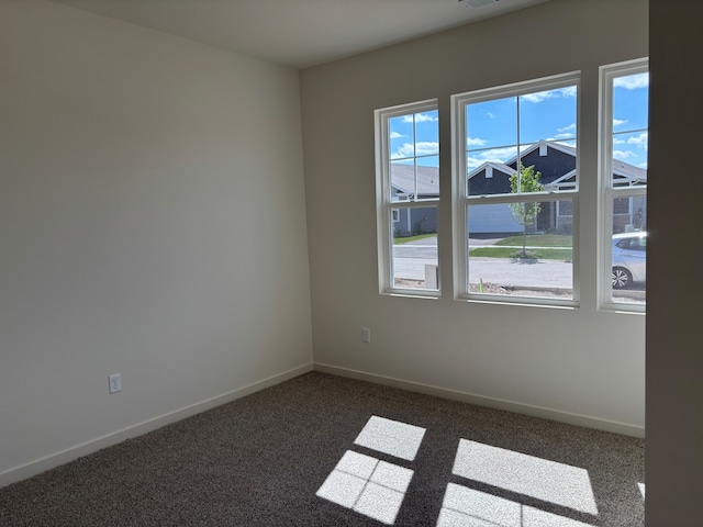 2278 Elderberry Ct, Wonder Lake, IL 60097 - unfurnished room with dark colored carpet and baseboards