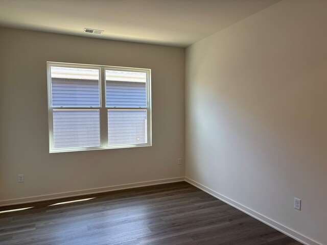 2278 Elderberry Ct, Wonder Lake, IL 60097 - spare room with dark wood-type flooring and baseboards