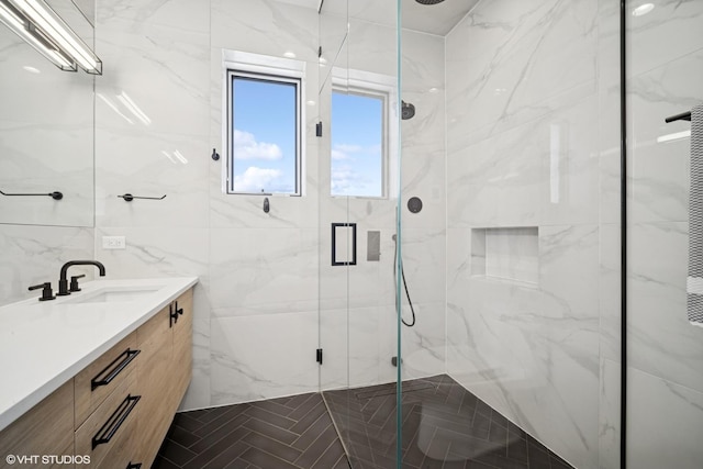 1543 N Wieland St Ph-N, Ph-N Chicago, IL 60610 - bathroom featuring a marble finish shower, vanity, and tile walls
